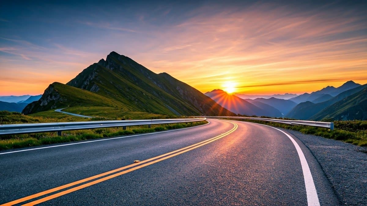 A winding mountain road leading to a vibrant sunrise, symbolizing the journey of life and the importance of seizing opportunities in the present moment.