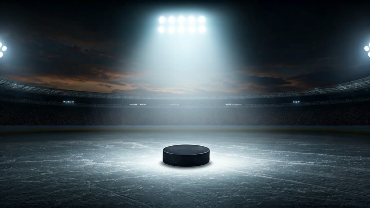 A spotlighted hockey puck on an ice rink, symbolizing opportunity and the potential for action.